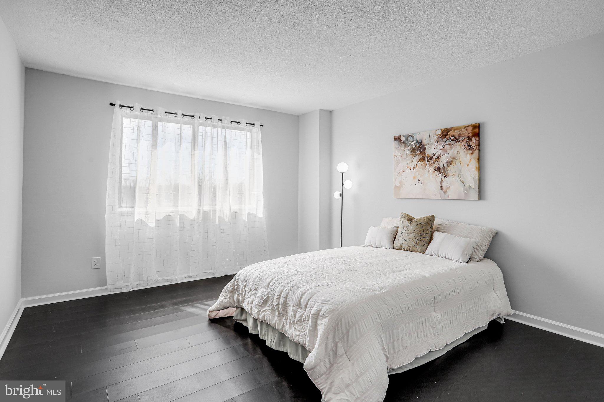 1836 Metzerott Road, Unit 627 Adelphi, MD 20783 - Photo 20 of 27 a bedroom with a bed and a window