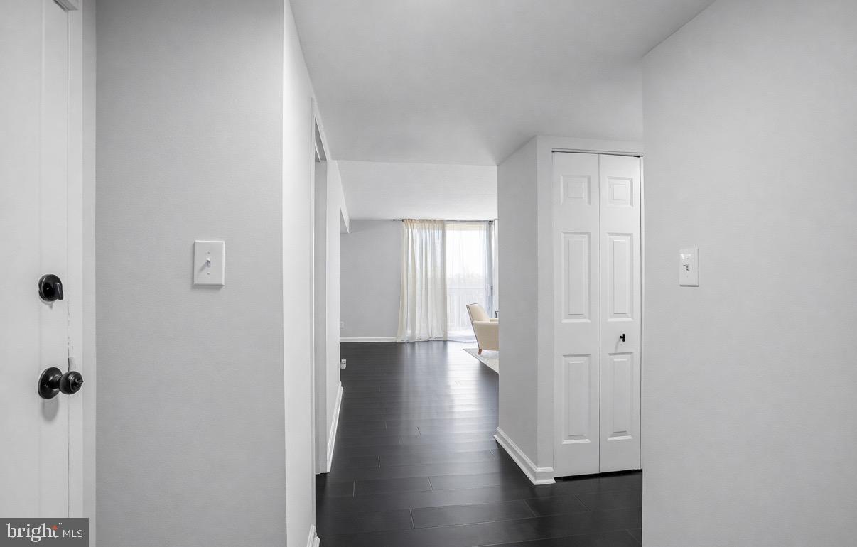 1836 Metzerott Road, Unit 627 Adelphi, MD 20783 - Photo 2 of 27 a view of a hallway with wooden floor