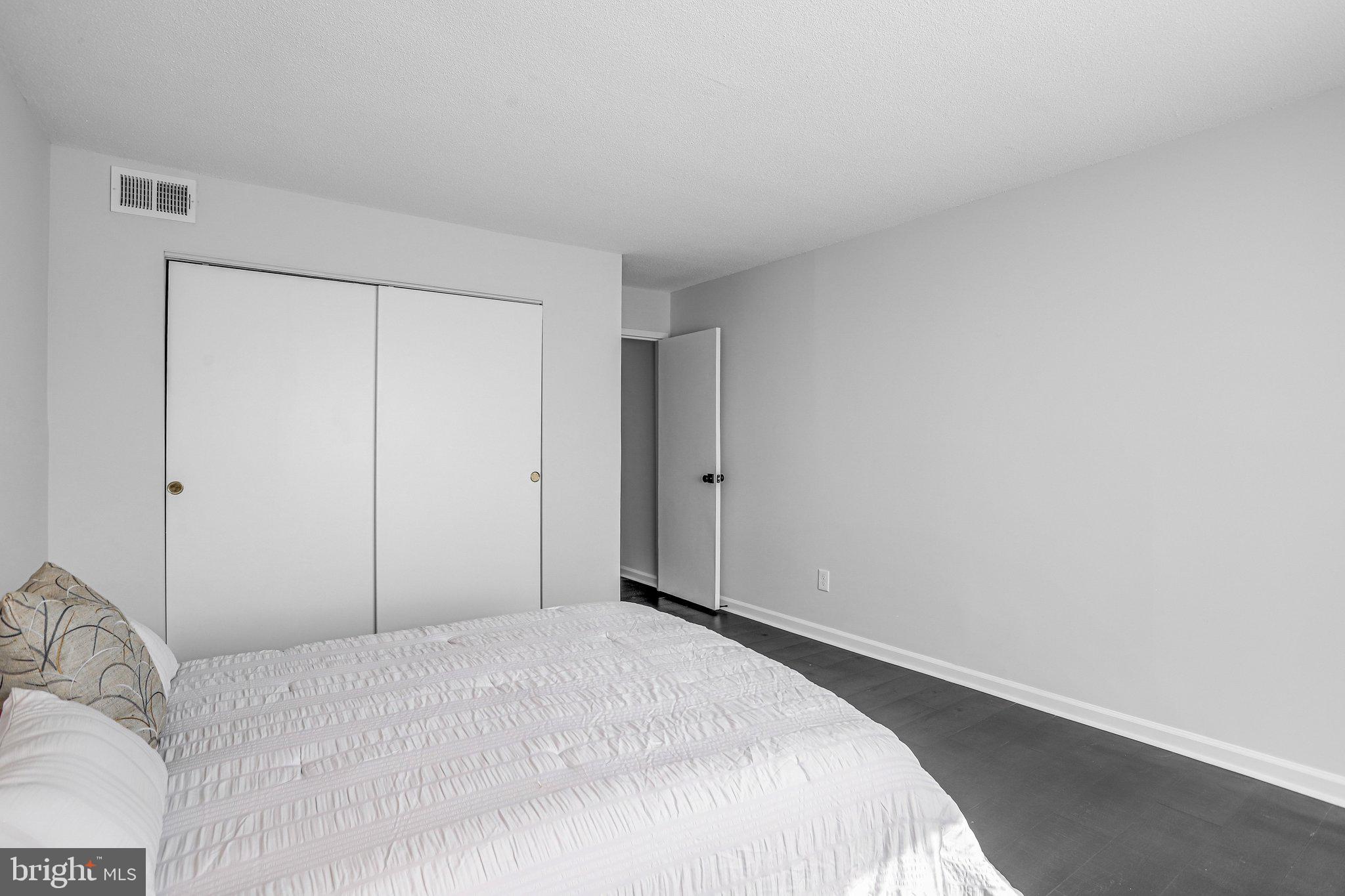 1836 Metzerott Road, Unit 627 Adelphi, MD 20783 - Photo 22 of 27 a bedroom with a bed and a closet