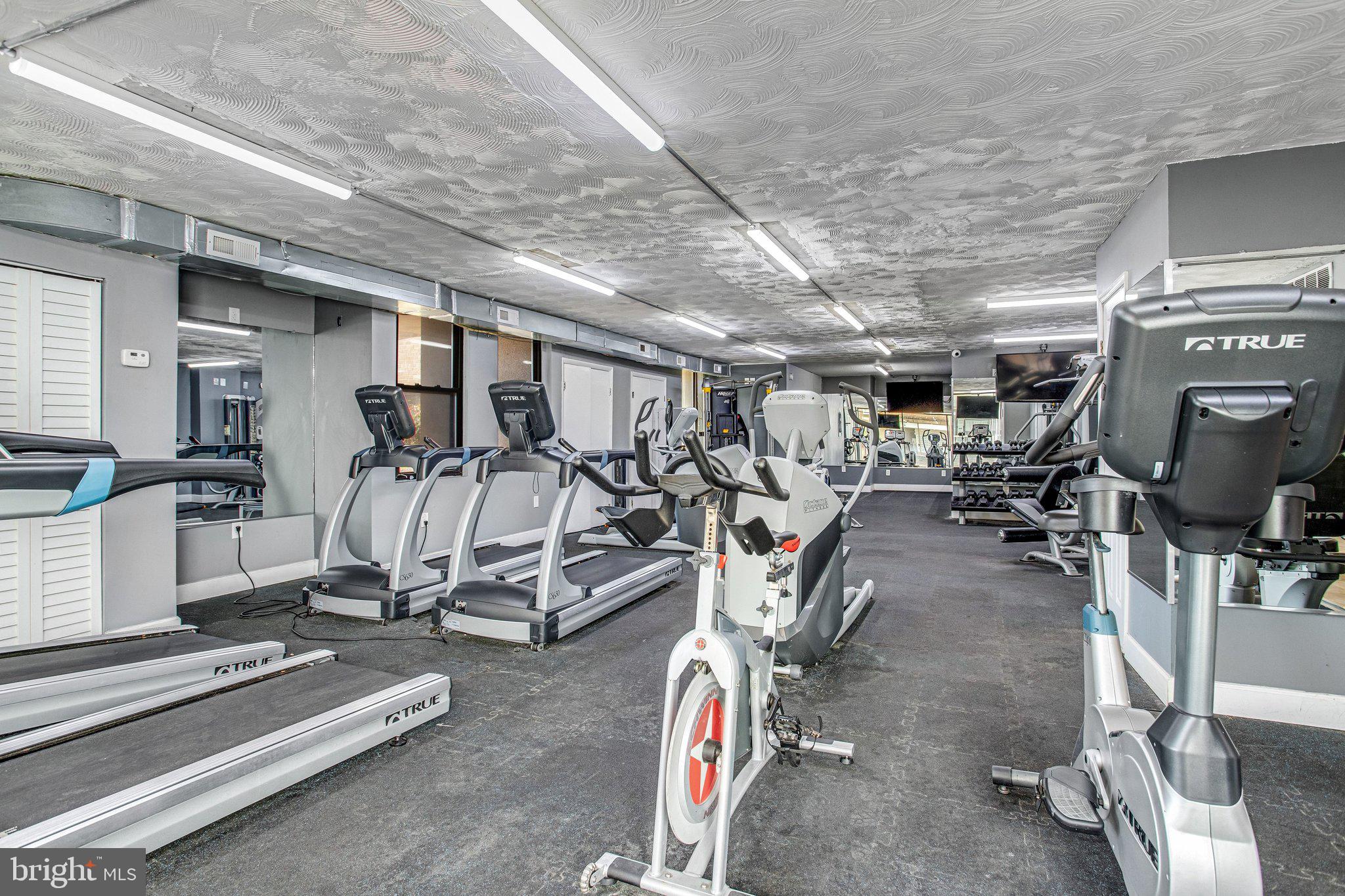1836 Metzerott Road, Unit 627 Adelphi, MD 20783 - Photo 24 of 27 a view of a room with gym equipment