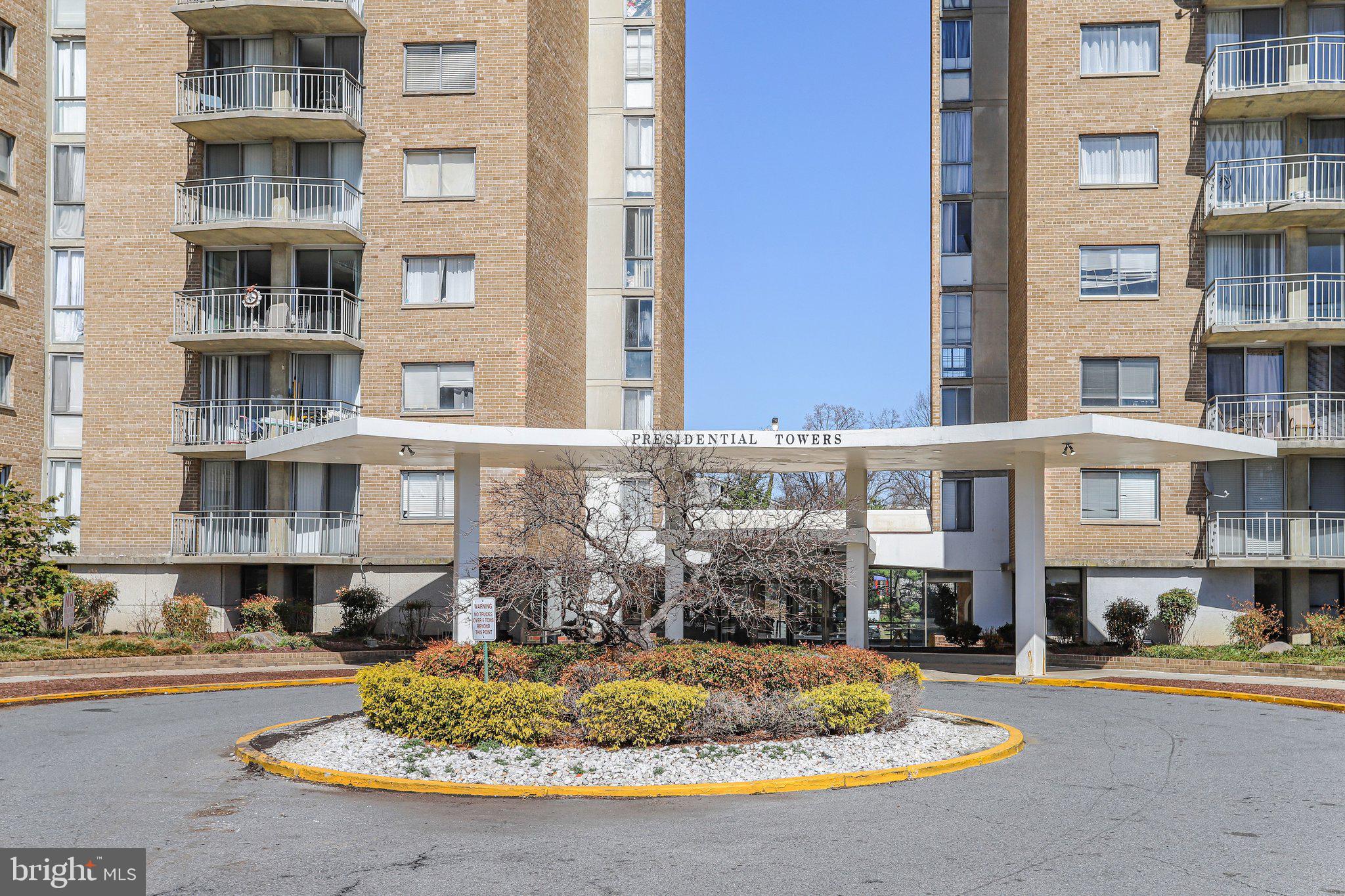 1836 Metzerott Road, Unit 627 Adelphi, MD 20783 - Photo 26 of 27 a front view of a multi story residential apartment building with a yard