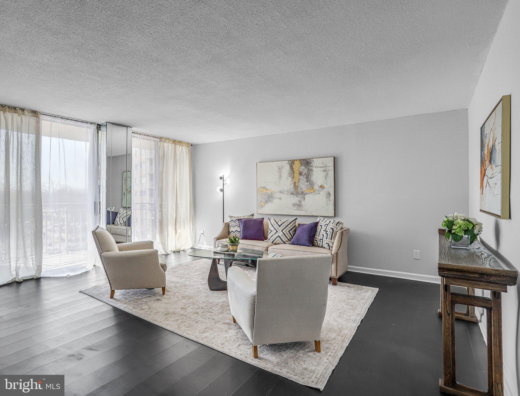 1836 Metzerott Road, Unit 627 Adelphi, MD 20783 - Photo 3 of 27 a living room with furniture and wooden floor