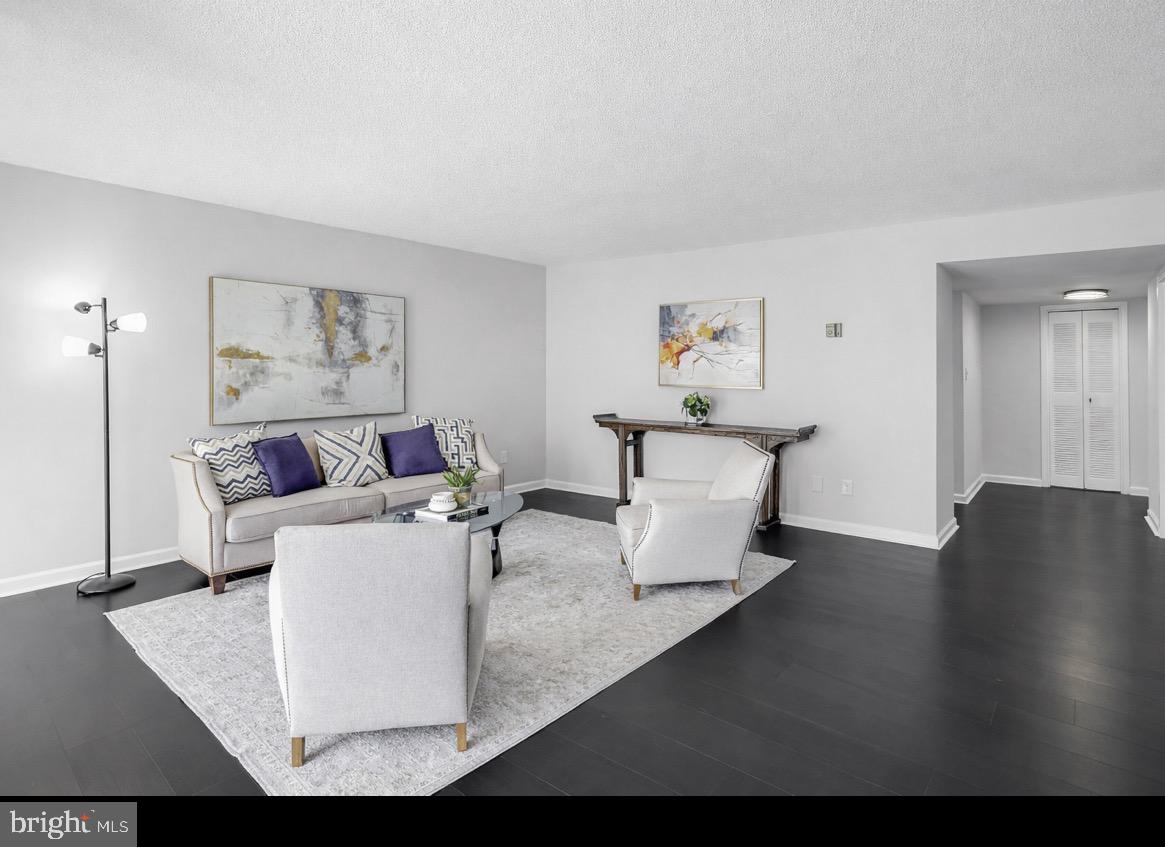 1836 Metzerott Road, Unit 627 Adelphi, MD 20783 - Photo 4 of 27 a living room with furniture and a couch