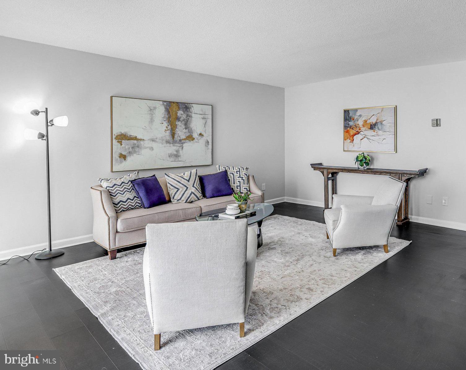 1836 Metzerott Road, Unit 627 Adelphi, MD 20783 - Photo 5 of 27 a living room with furniture and a couch