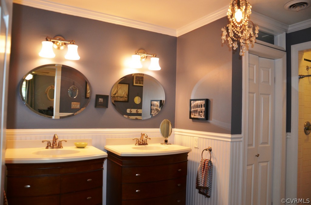 2800 Cassaway Road Midlothian, VA 23113 - Photo 12 of 19 a bathroom with double vanity sinks and a mirror