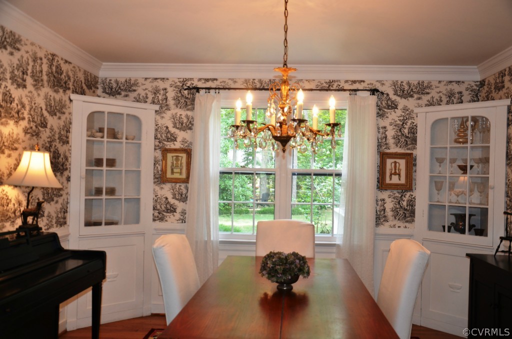 2800 Cassaway Road Midlothian, VA 23113 - Photo 4 of 19 a view of a dining room with furniture a chandelier and wooden floor