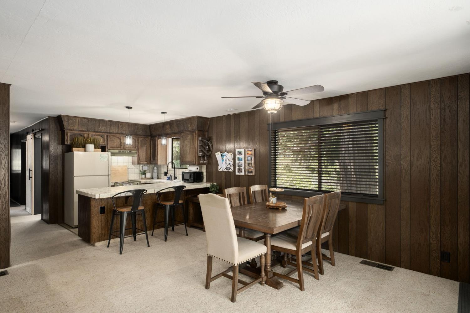 42488 Rock Ledge Road Shaver Lake, CA 93664 - Photo 10 of 26 a view of a dining room with furniture
