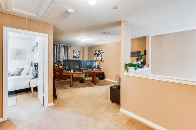 a view of living room filled with furniture and a window