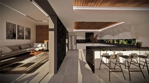 a kitchen with stainless steel appliances kitchen island granite countertop a stove and cabinets