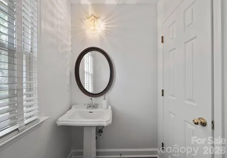 a bathroom with a sink a mirror and a shower