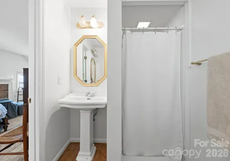 a bathroom with a sink a mirror and vanity