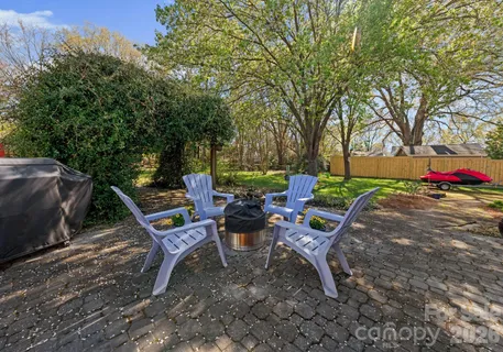 a view of a backyard with sitting area