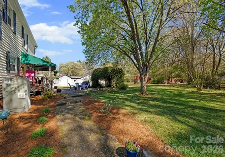 a view of a park with large trees