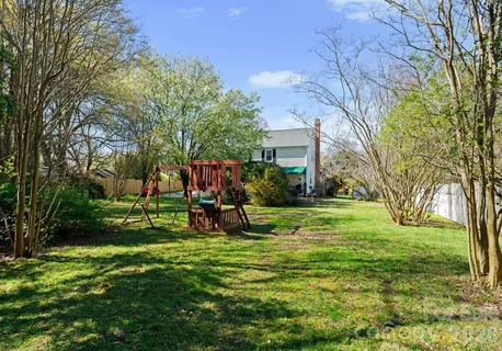a view of a house with a yard porch and sitting area