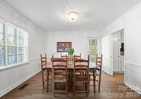 a view of a dining room with furniture and window