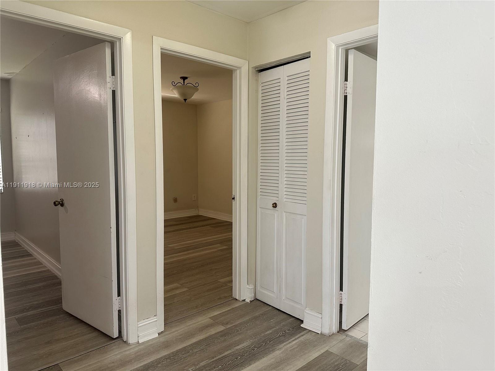 11354 Southwest 87th Terrace, Unit 11354 Miami, FL 33173 - Photo 12 of 25 a view of a hallway with wooden floor and staircase
