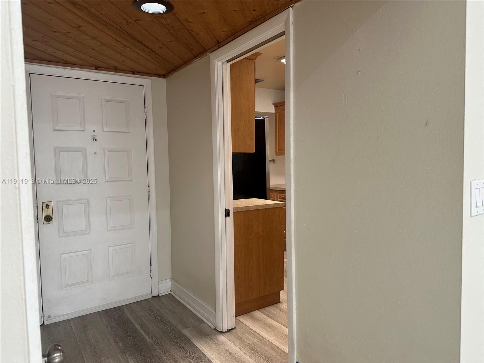 11354 Southwest 87th Terrace, Unit 11354 Miami, FL 33173 - Photo 17 of 25 a view of a hallway with wooden floor