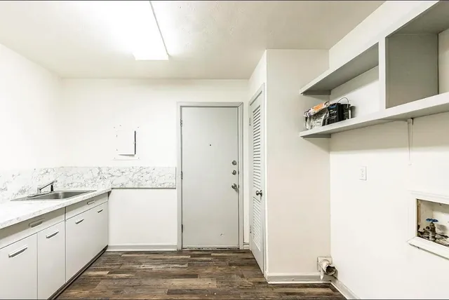 a view of a kitchen from the hallway