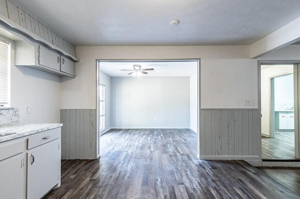 5426 43rd Street Lubbock, TX 79414 - Photo 21 of 27 an entryway with wooden floor and cabinet