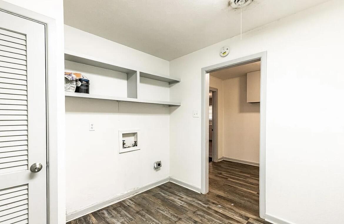 5426 43rd Street Lubbock, TX 79414 - Photo 23 of 27 a view of a hallway with wooden floor and closet