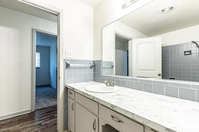 a bathroom with a sink double vanity and a bathtub