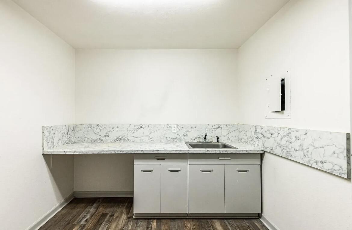 5426 43rd Street Lubbock, TX 79414 - Photo 27 of 27 a bathroom with a granite countertop sink and a mirror