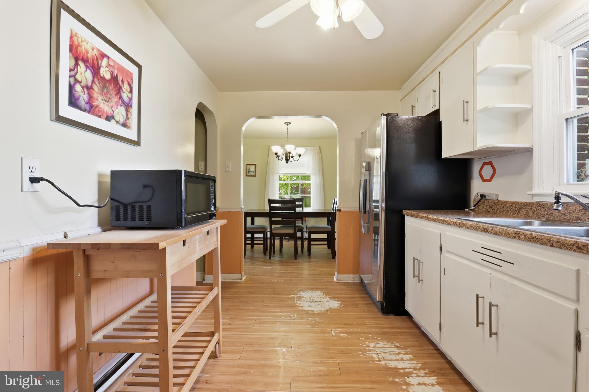 225 North Main Street Manchester, PA 17345 - Photo 13 of 53 a kitchen with stainless steel appliances granite countertop a refrigerator and a stove top oven