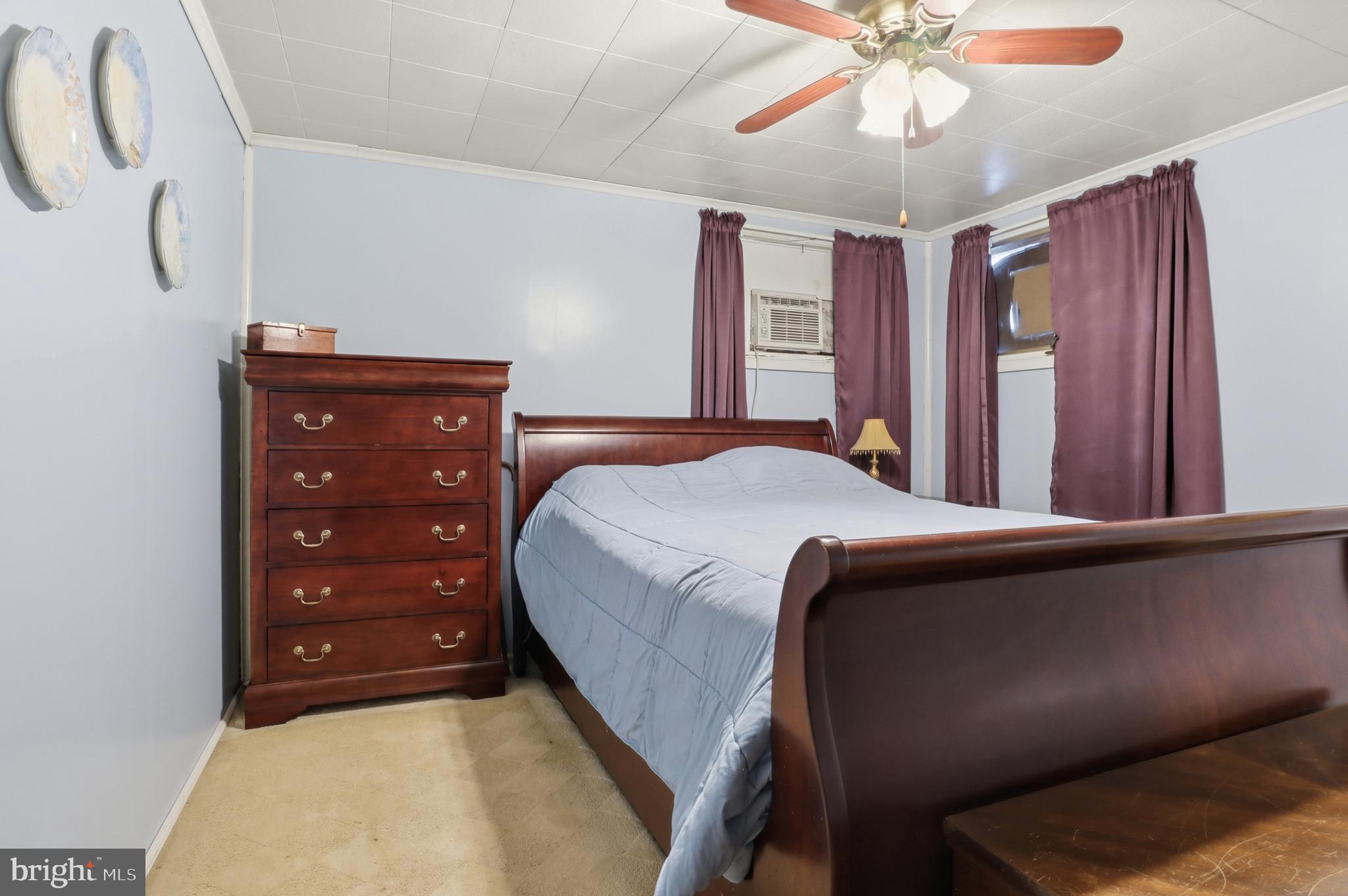 225 North Main Street Manchester, PA 17345 - Photo 17 of 53 a bedroom with a bed and a chandelier