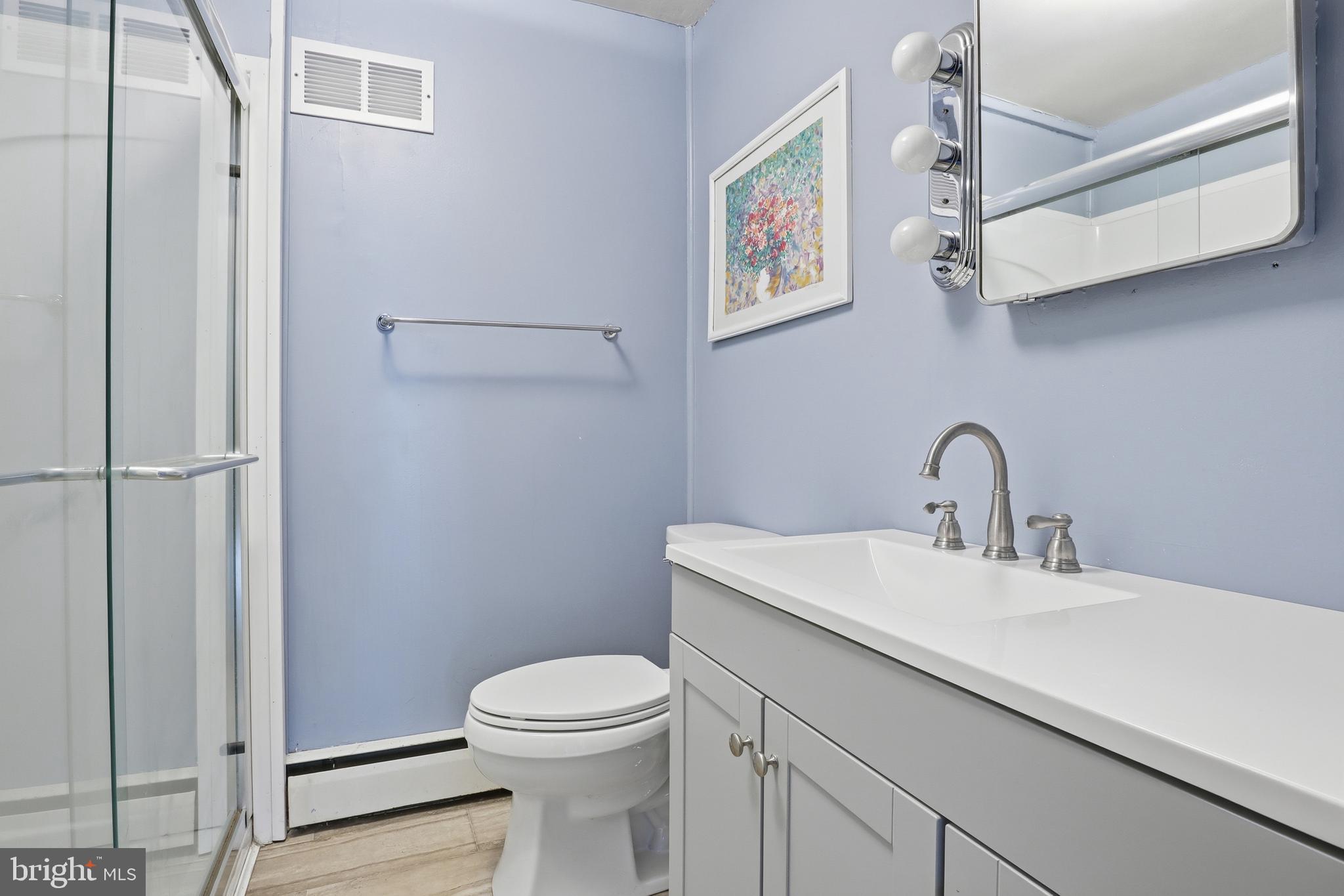 225 North Main Street Manchester, PA 17345 - Photo 21 of 53 a bathroom with a sink a toilet and vanity