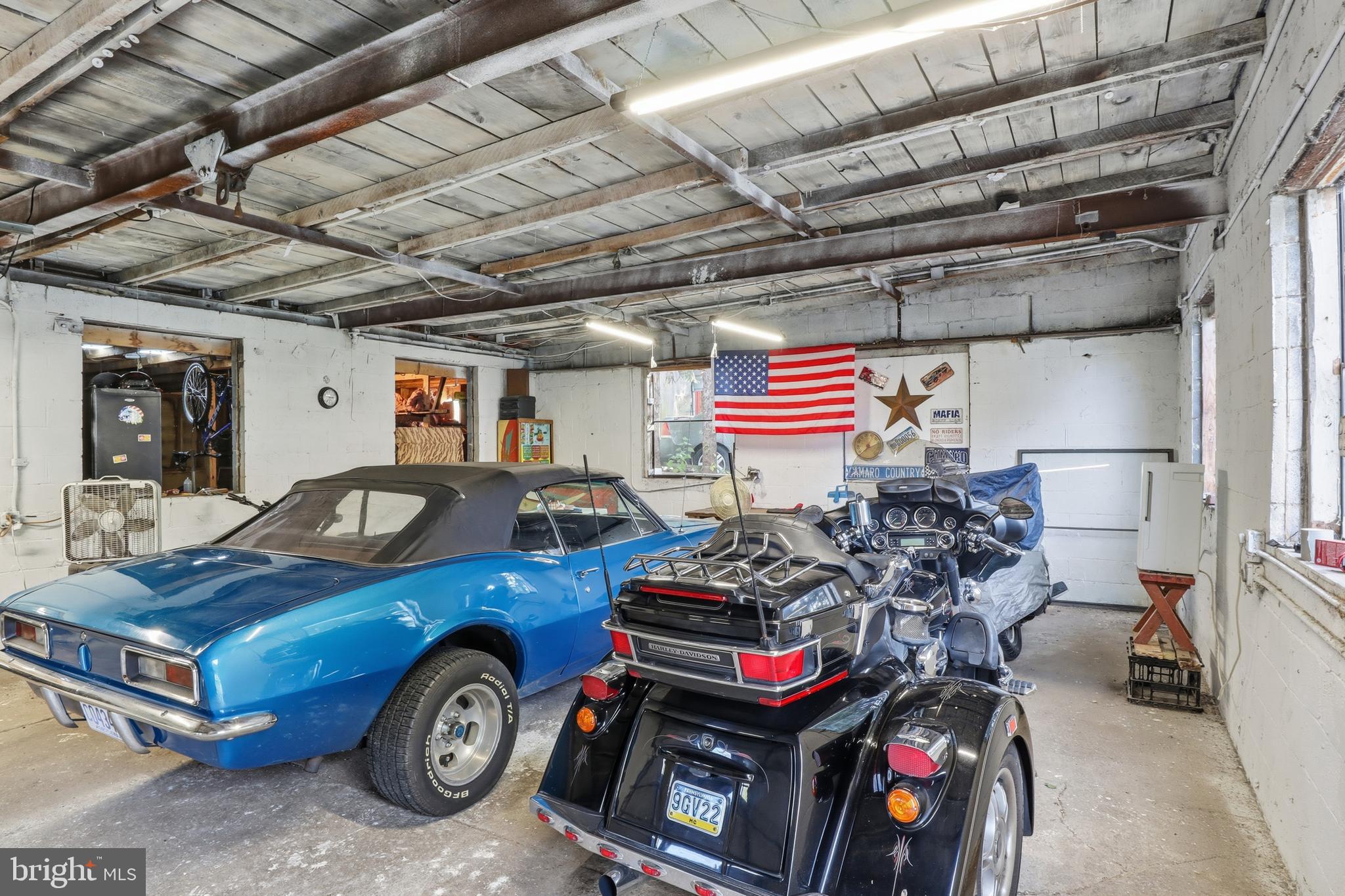 225 North Main Street Manchester, PA 17345 - Photo 33 of 53 a car and bike in a garage