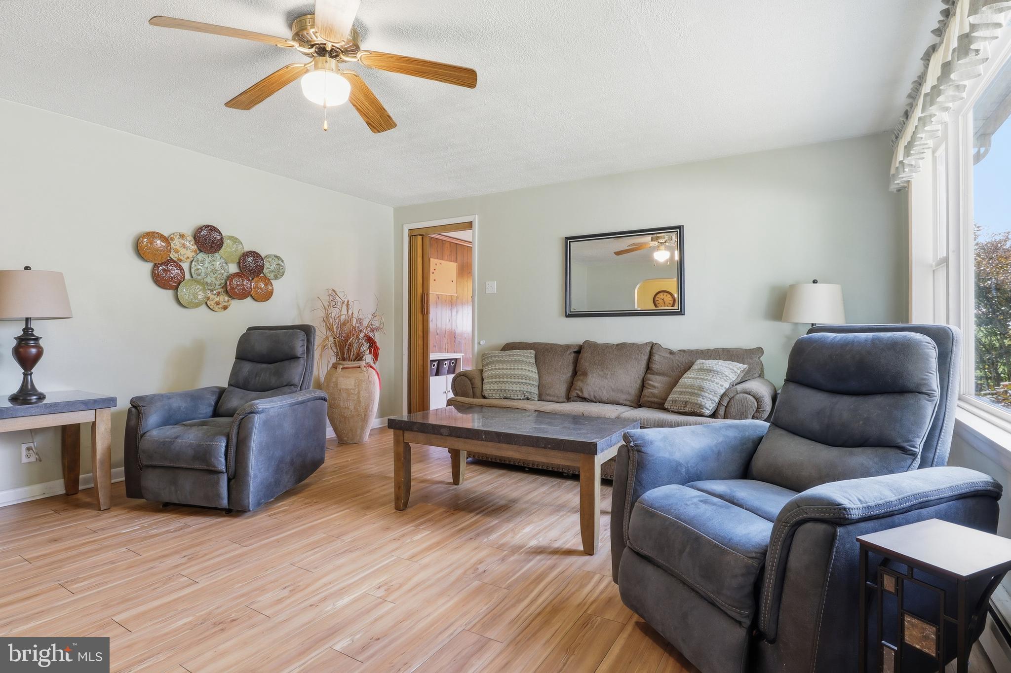 225 North Main Street Manchester, PA 17345 - Photo 5 of 53 a living room with furniture and a wooden floor