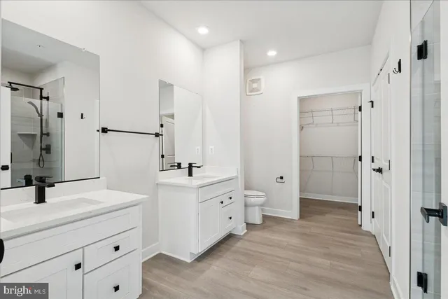 a bathroom with a glass shower door