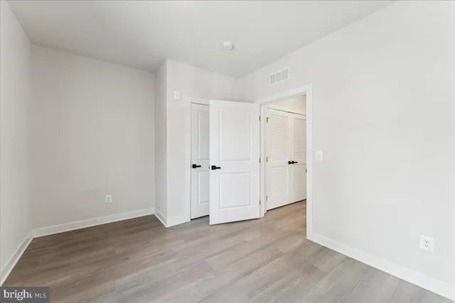 a view of a kitchen with wooden floor