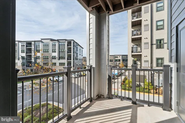 a view of a cars park in front of a building