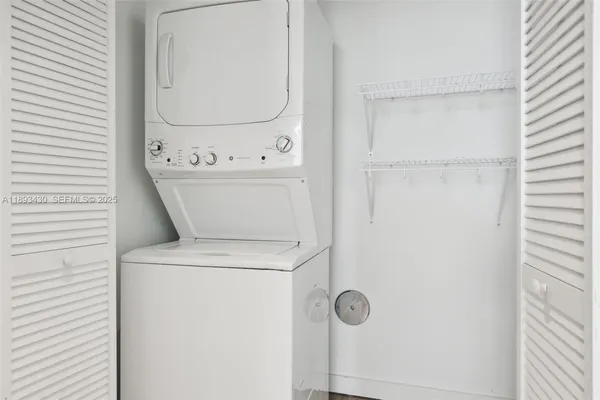 a view of bathroom with a washer and dryer