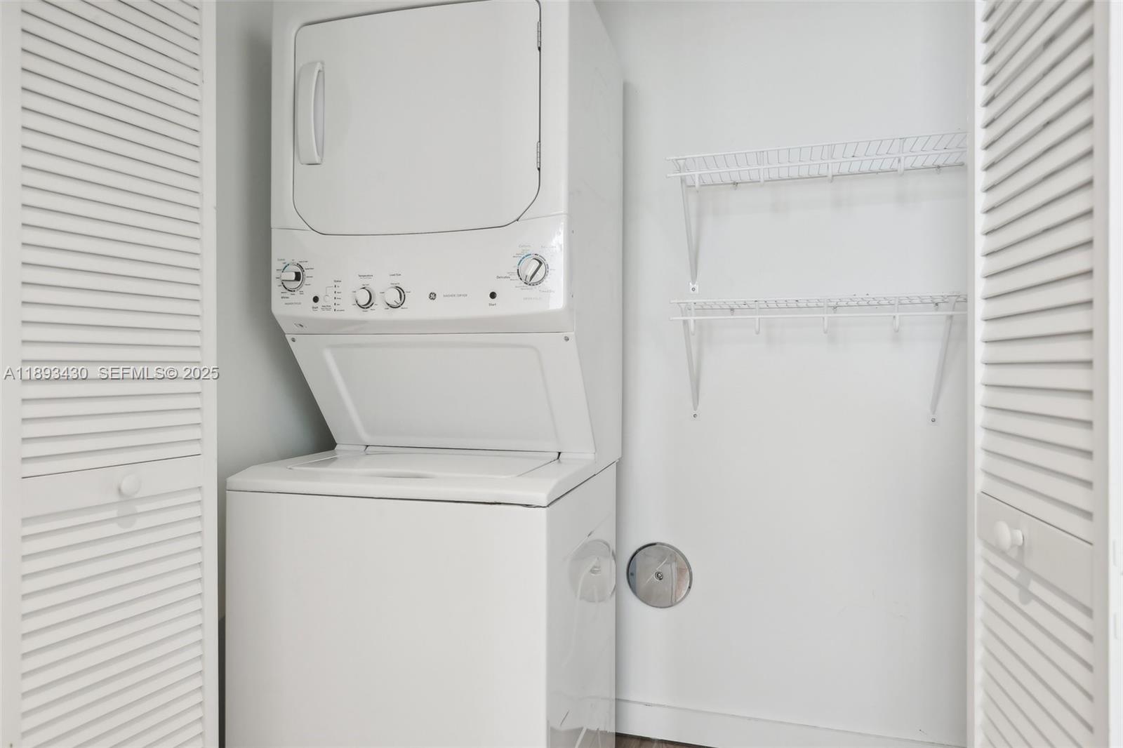 1501 Southwest 37th Avenue, Unit 708 Miami, FL 33145 - Photo 14 of 27 a view of bathroom with a washer and dryer