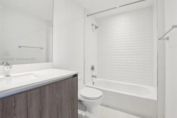 a bathroom with a sink a toilet and a bathtub