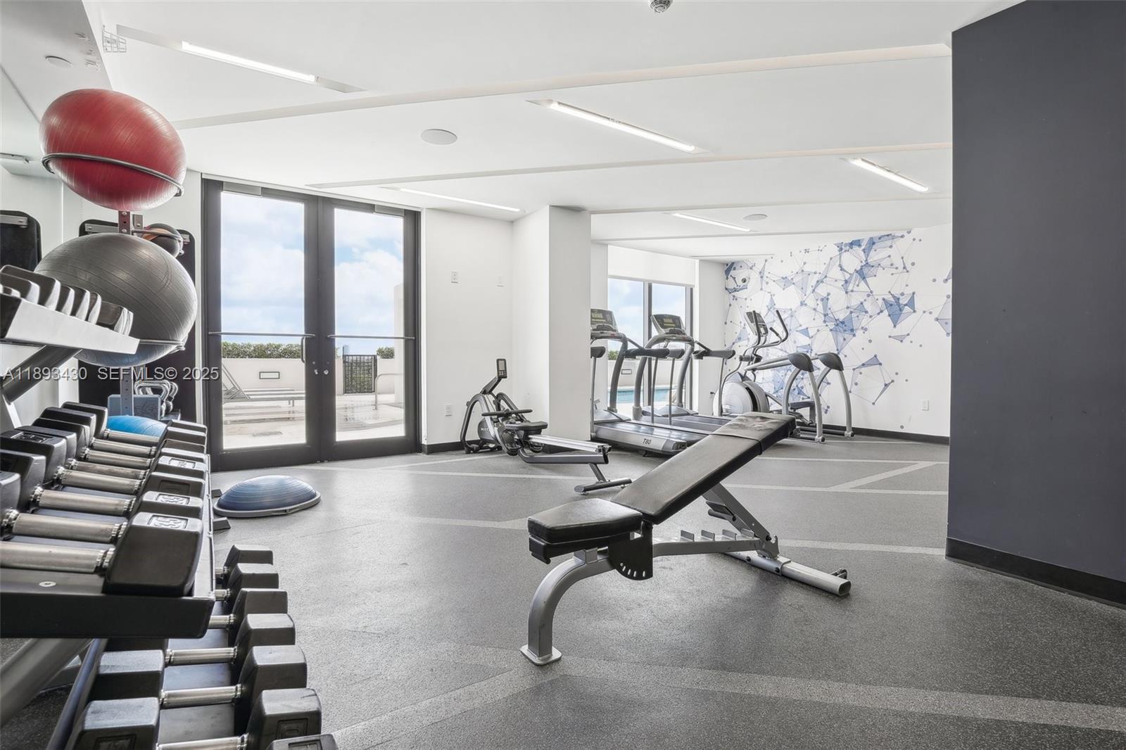 1501 Southwest 37th Avenue, Unit 708 Miami, FL 33145 - Photo 20 of 27 a view of a room with gym equipment