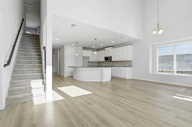 a view of kitchen with cabinets and wooden floor