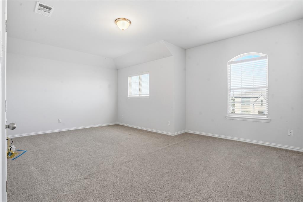 461 Windy Knoll Road Fort Worth, TX 76028 - Photo 20 of 30 an empty room with windows