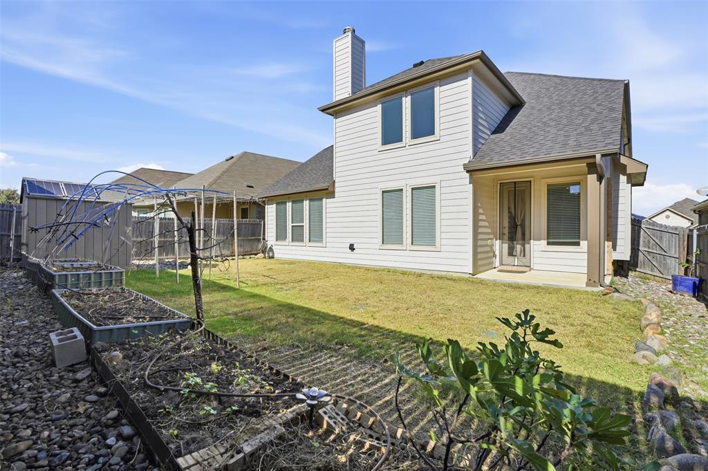 461 Windy Knoll Road Fort Worth, TX 76028 - Photo 25 of 30 a view of a house with a backyard