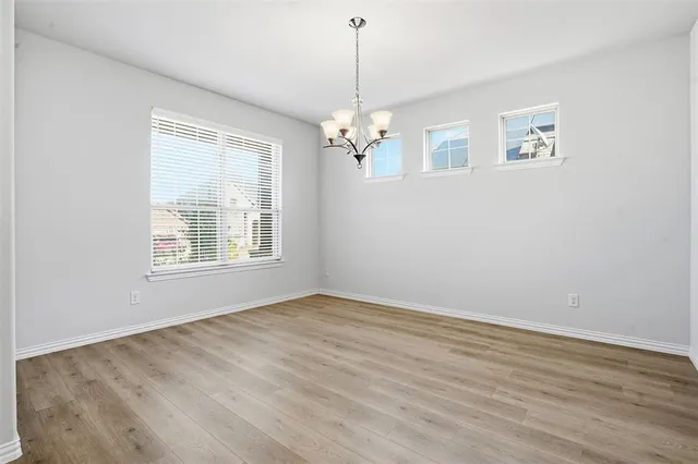 a view of livingroom with window ceiling fan and hardwood floor