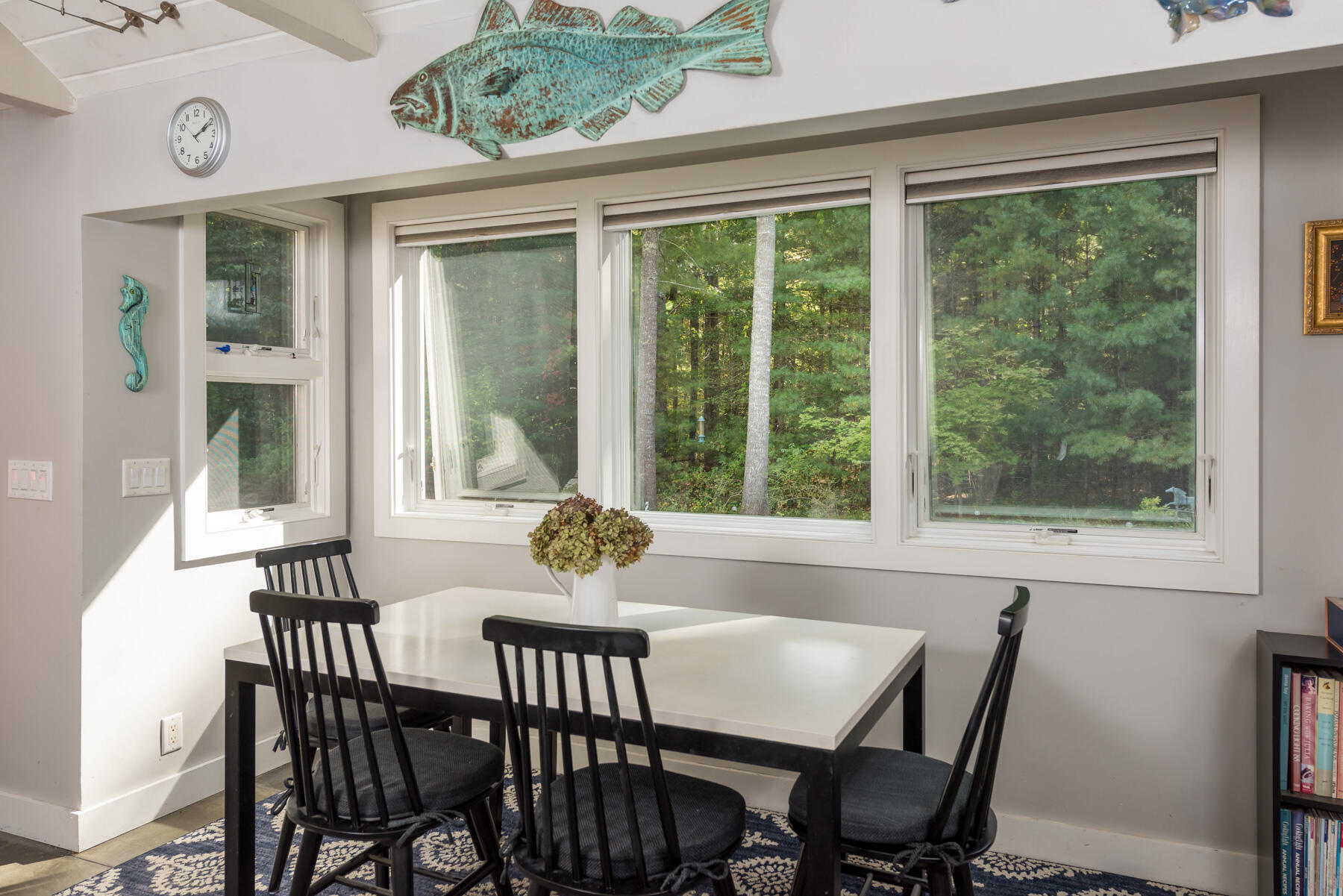 58 Delano Road Marion, MA 02738 - Photo 14 of 41 a view of a dining room with furniture large windows and wooden floor