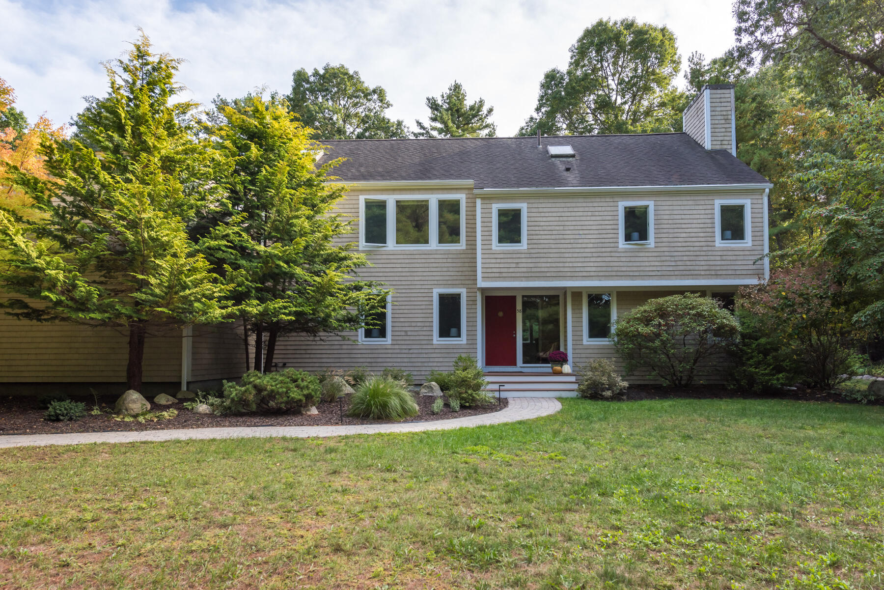 58 Delano Road Marion, MA 02738 - Photo 3 of 41 a front view of a house with a yard and garage