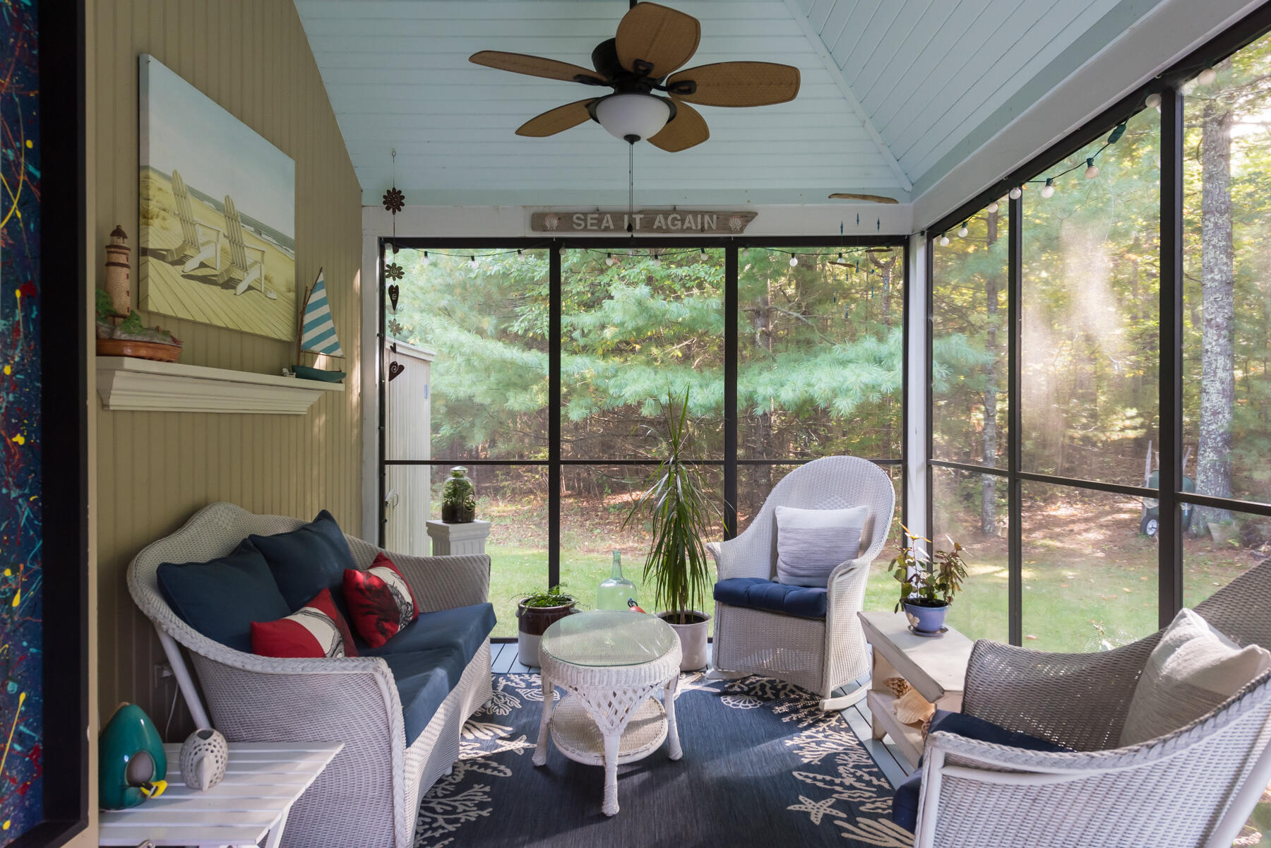 58 Delano Road Marion, MA 02738 - Photo 31 of 41 a living room with patio furniture and a large window