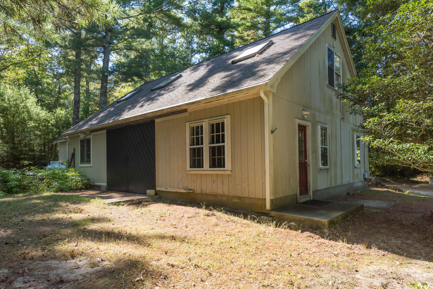 58 Delano Road Marion, MA 02738 - Photo 33 of 41 a backyard of a house with wooden fence and large trees