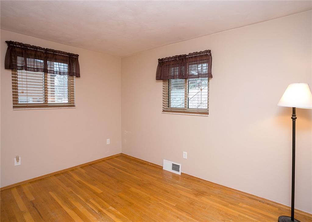 869 Blue Ridge Road Pittsburgh, PA 15239 - Photo 16 of 25 Second bedroom with 2 windows. Blow insulation added to walls & in ceiling of garage for extra warmth.
