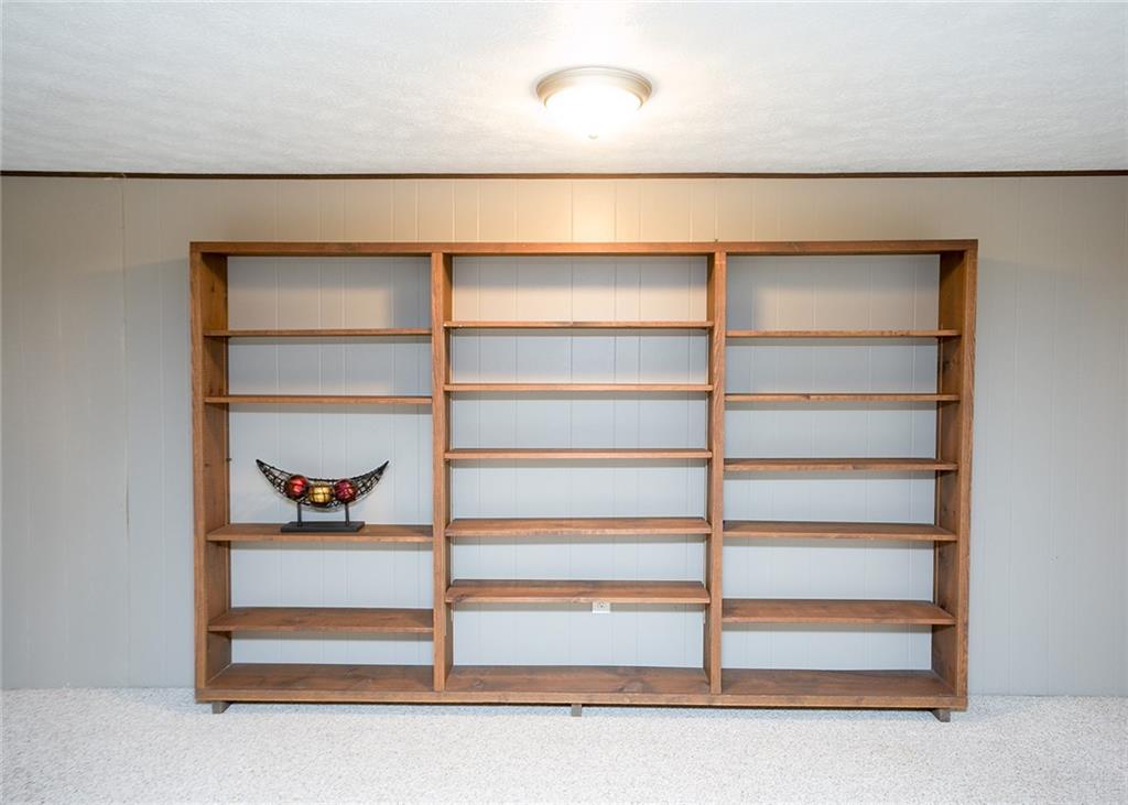 869 Blue Ridge Road Pittsburgh, PA 15239 - Photo 21 of 25 Wooden shelving attached to the wall.