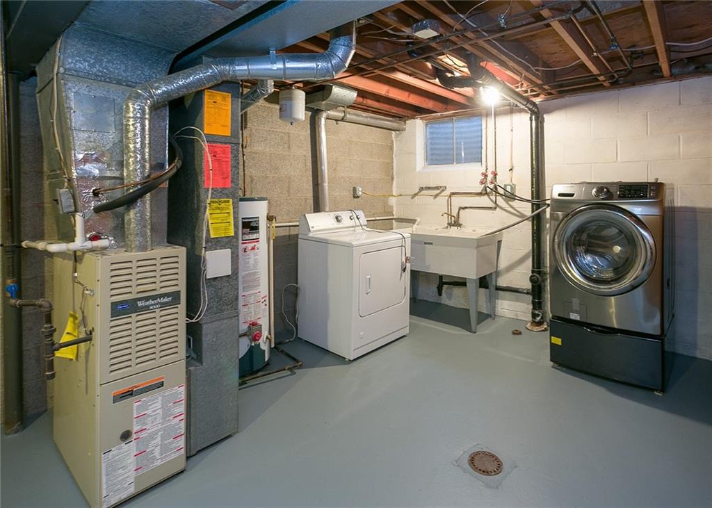 869 Blue Ridge Road Pittsburgh, PA 15239 - Photo 23 of 25 Newly painted laundry room floor. there is a lot of storage in this room. Great place for a closet to store winter clothes and boots.