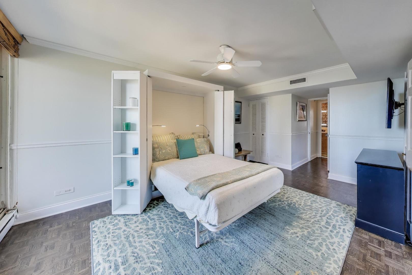 201 East Chestnut Street, Unit 24C Chicago, IL 60611 - Photo 11 of 33 a spacious bedroom with a bed and a dresser in it